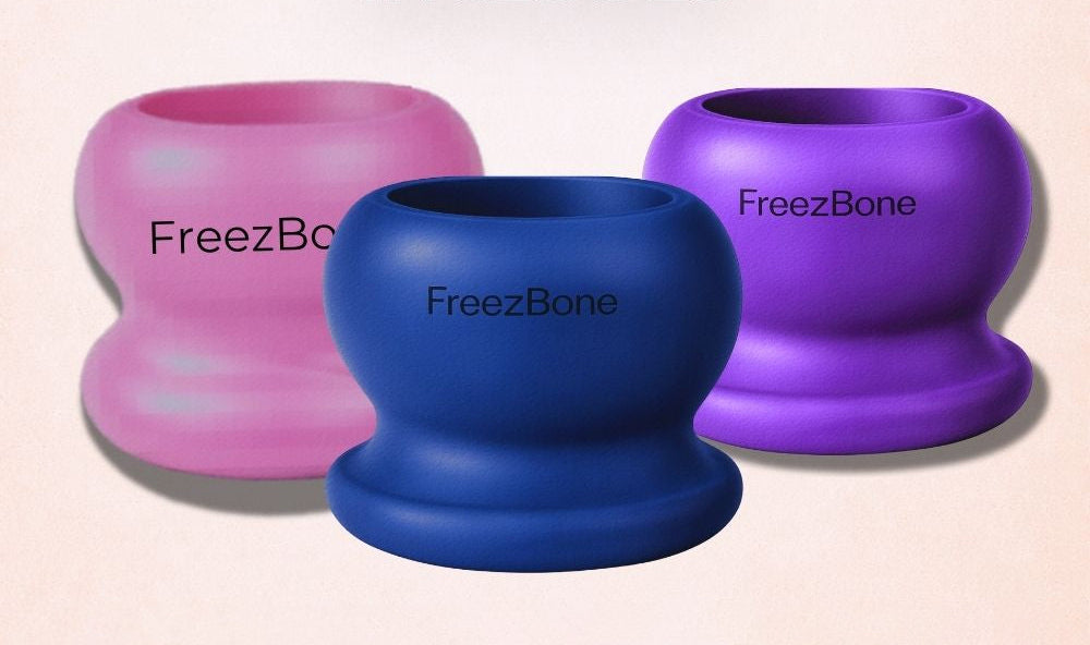 Three Freezbone treat cups in pink, blue and purple